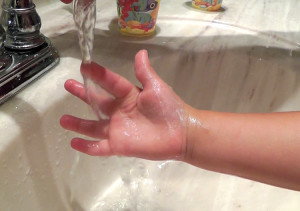 Kid's hand in water